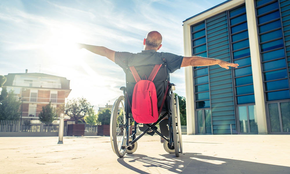 Man in wheelchair, feeling free